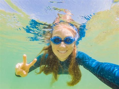 Premium Photo Happy Young Woman Swimming Underwater In The Tropical Ocean