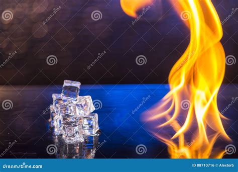 Cubes Of Ice And Fire On A Water Surface On An Abstract Background