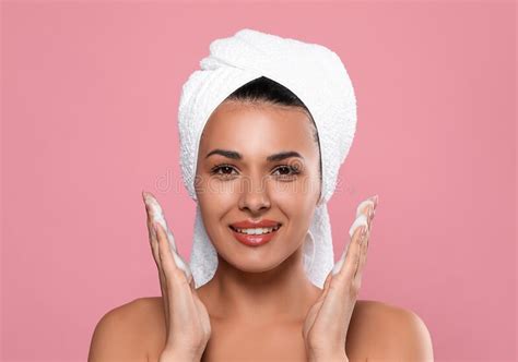 Beautiful Woman Applying Facial Cleansing Foam On Background Stock