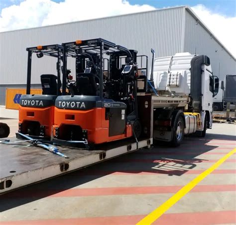 Toyota Forklifts Being Transported On A Low Bed Tow Truck Select Tilt