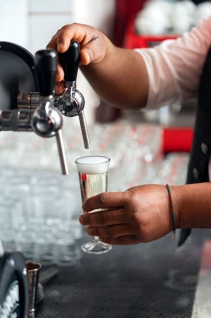 Free Photo Bartender Preparing Drink At Bar