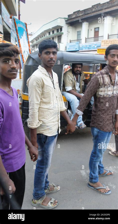 Indian men holding hands hi-res stock photography and images - Alamy