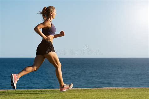 Fitness woman running stock photo. Image of outdoor - 129020896