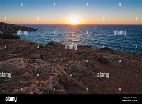 Sunset over Gnejna Bay, west side of the island, Malta Stock Photo - Alamy