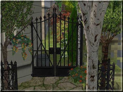 An Image Of A Gated Entrance To A House With Flowers And Trees Around It