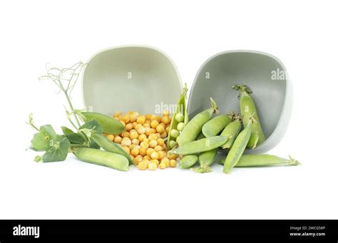 Dried Yellow Peas Spilling Out From Bowl And Fresh Garden Peas Pods