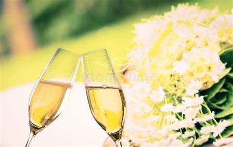 Champagne Flutes With Golden Bubbles On Blue Light Bokeh Background Stock Image Image Of