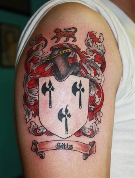 Awesome black red family crest tattoo on half sleeve - Tattooimages.biz