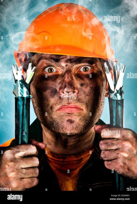 Electric shock sees a shocked electrician man Stock Photo - Alamy