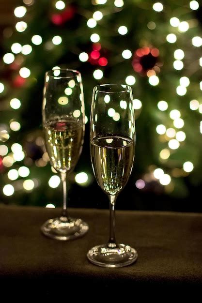 Premium Photo Two Glasses Of Champagne On The Background Of A