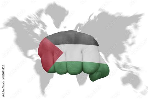 fist with the national flag of palestine on a world map background ...