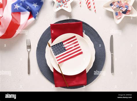 Patriotic Table Setting With American Flag And Decoration In National