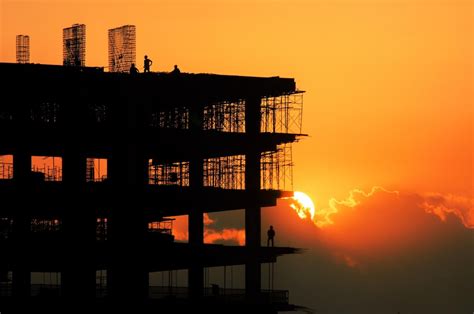 premium photo silhouette building  orange sky  sunset
