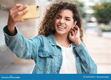 Young Woman Taking Selfies With Her Mobile Phone Outdoors Stock Image