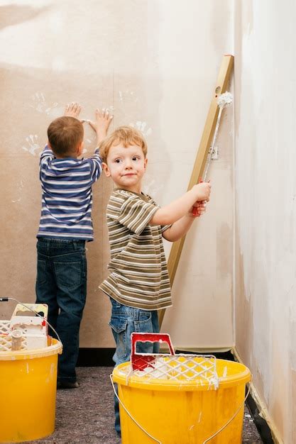 Premium Photo | Children painting wall