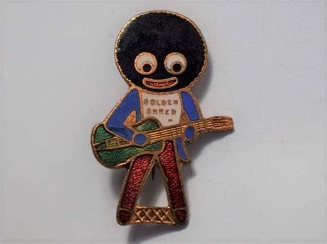 135 Original 1950s Robertsons Golden Shred Golly Badge Guitar Player