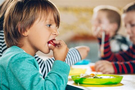 Little Boy Eating With His Hands By Stocksy Contributor Lumina