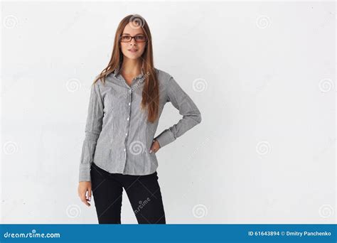 Portrait Of Beautiful Business Woman Standing Against White Wall Stock