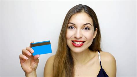 Premium Photo Portrait Of Smiling Young Woman Holding Credit Card