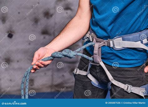 Close-up of Climber with Climbing Equipment, Tying Knot on Safety ...