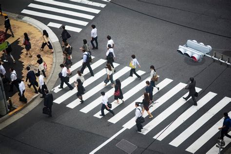 Premium Photo High Angle View Of People Walking On Road