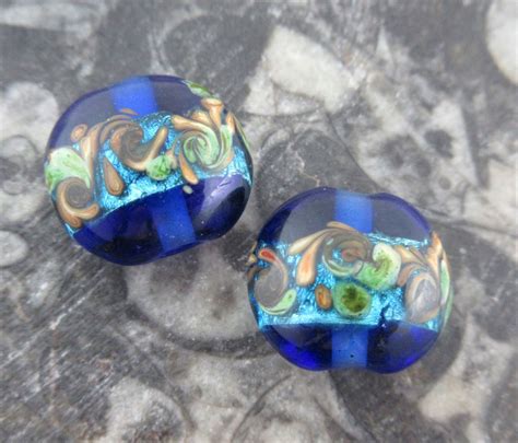 Blue Lentil Glass Lampwork Beads Ocean Wave Swirl Design Aqua Foil Tan And Green Accents On