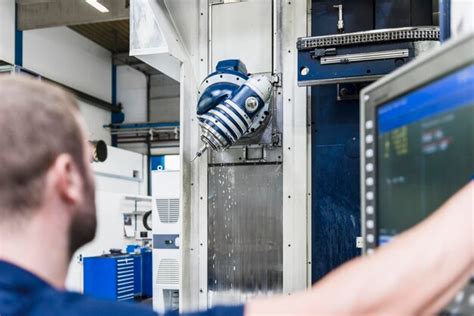 Premium Photo Man Operating Machine In Industrial Factory