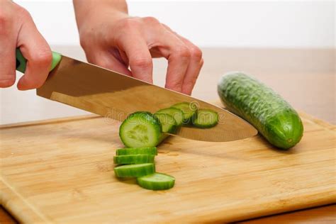 Woman Chopping Cucumber For Salad Healthy Food Concept Stock Image