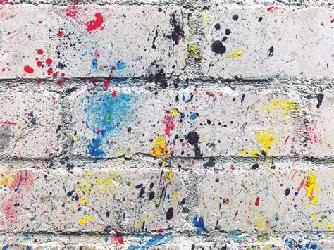 Paint spatter on brick stock photo. Image of spatter - 242634014