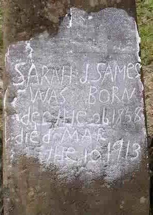 An Old Grave Marker With Writing On It