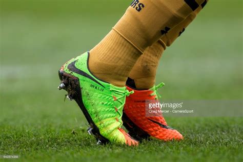 The personalised boots of Tottenham Hotspur's Harry Kane detailed with ...