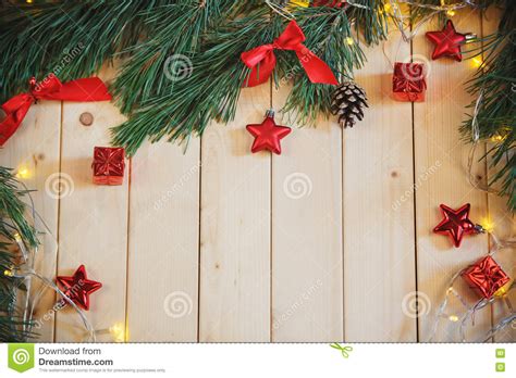 Christmas Tree Branch Red Bow T Box And Garland On Light Wooden