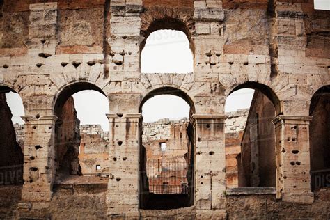 Old Stone Wall Of Colosseum With Arches Rome Italy Stock Photo