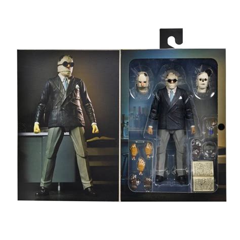 Two Action Figures One In Suit And The Other In Sunglasses Are Posed