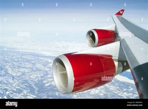 Virgin Atlantic Boeing 747-400 wing view in flight making landfall en ...