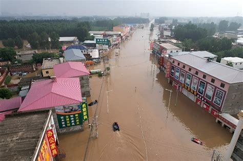 Streets become rivers as Beijing records heaviest rain in 140 years