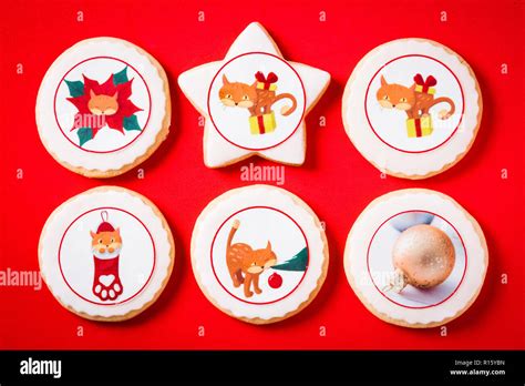 Christmas Butter Cookies Decorated With Christmas Graphics On Red