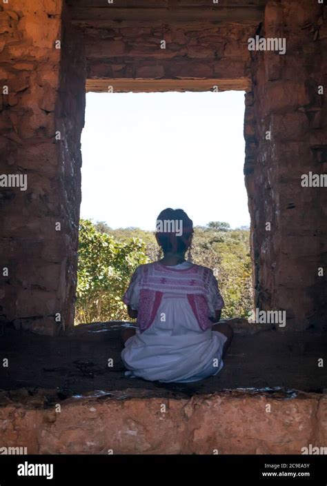 Woman Meditating At Mayan Archeological Site Of Dzibilchalt N Near