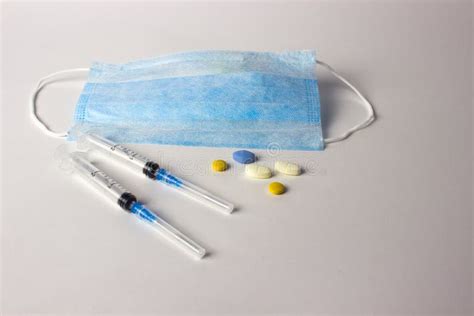 Medical Mask With Syringes And Tablets Stock Photo Image Of