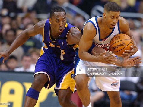 Los Angeles Lakers Guard Kobe Bryant Attempts To Wrest The Ball From