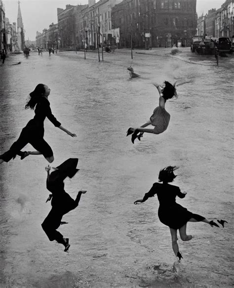 Krea A Woman Wearing A Dress Long Legs Leaping Over A Large Puddle