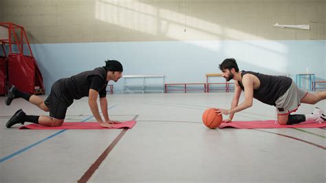 Boys Do Coordination And Balance Exercises With Basketball 49810914
