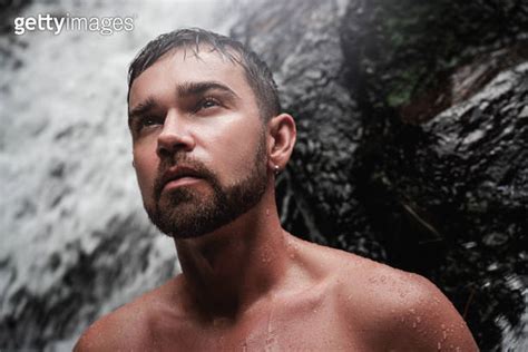 Closeup portrait of handsome bearded man with wet skin and hair 이미지