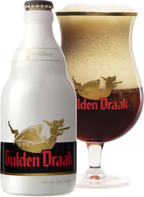 a glass filled with liquid next to a bottle of golden draak beer on a ...