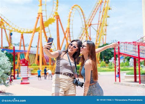 Teenage Girls Traveling in an Amusement Park. a Group of Female Friends ...