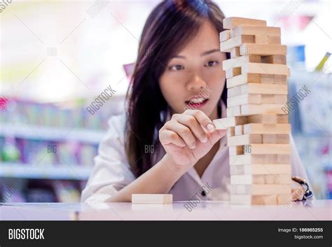 Asian Lady Play Jenga Image And Photo Free Trial Bigstock