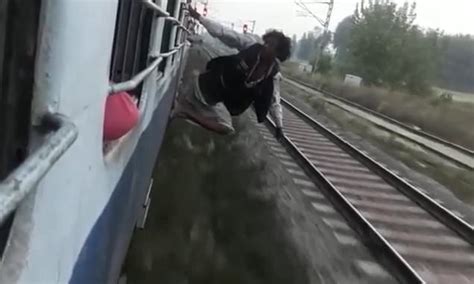 Daredevil Hangs From Side Of Fast Moving Train Before Angry Passengers