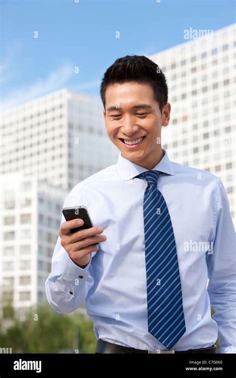 Businessman Using Mobile Phone Stock Photo Alamy