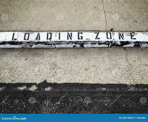 A Loading Zone Sign Painted on a Curb Stock Image - Image of zone ...