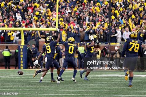 Rod Moore Of The Michigan Wolverines Celebrates With Mike Sainristil